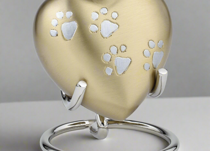 Royal Rapture Heart Urn in Black color with paw print for pet memorial.